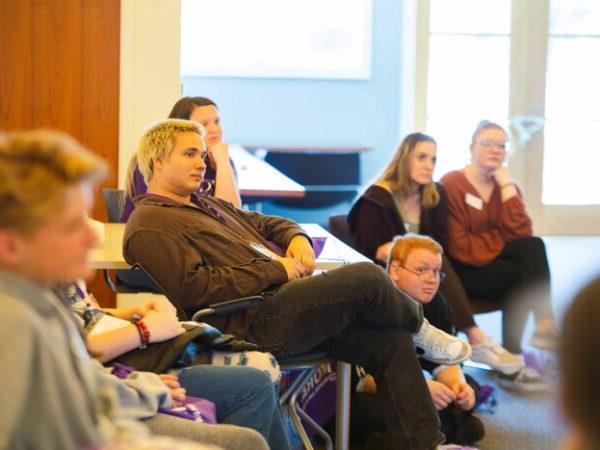 a group of people sitting in a room